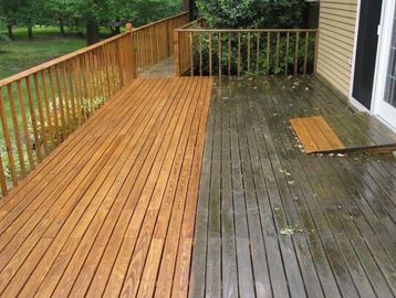 Half of a wooden deck is freshly cleaned, the other half is dirty.