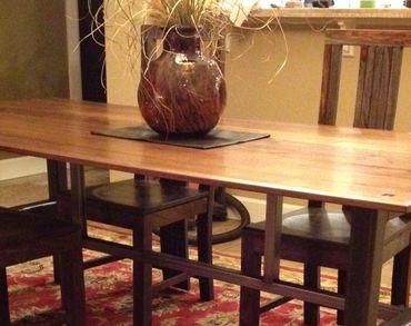 Black Walnut dinning room table with custom made 2 1/4" tube steel base. 6' 11" L x 40" W x 30" H Ea