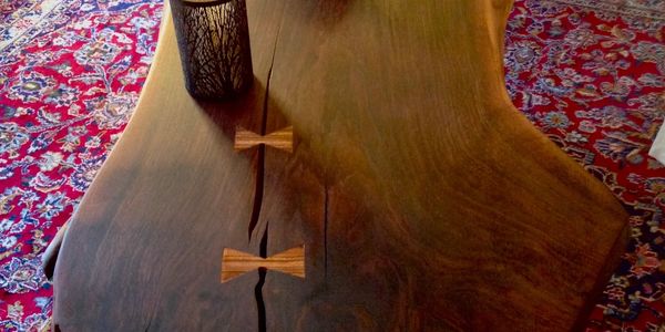 4' x 34" Black Walnut Live Edge / Zebra Wood bow ties. Legs are steel designed to duplicate I beams