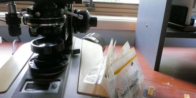 Microscope and goat faecal samples ready for worm egg counting
