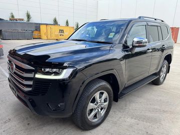 Black Toyota Land Cruiser parked outdoors.
