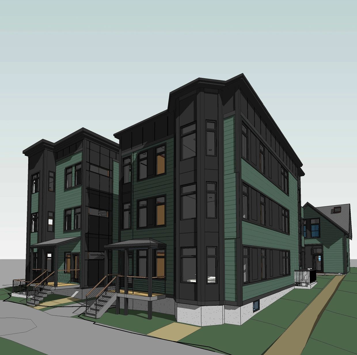 Modern three-story residential building with green and black exterior.
