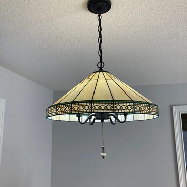 a lamp hanging from a ceiling in a room