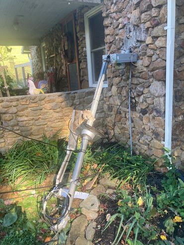 a large metal object sitting on the side of a building