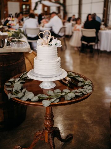 Round wood table with cake on top