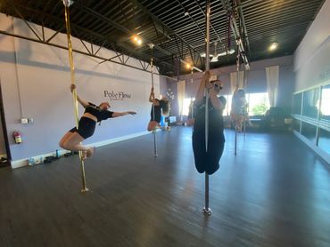 Calgary's Dance and Aerial Arts best pole dance class pole lessons, & aerial arts hoop, hammock,