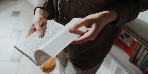 Customer reviewing an employee handbook for I-9