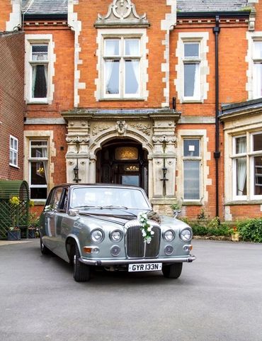 A classic Daimler DS420 limousine car prepared for a wedding