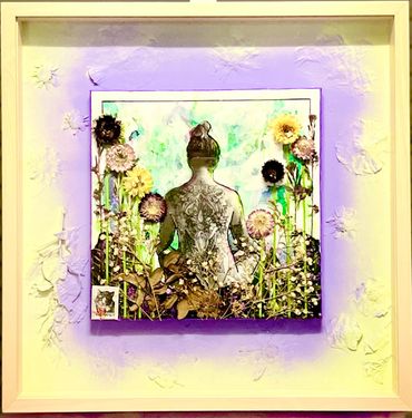 Framed artwork of a tattooed woman surrounded by flowers with a purple glow background.