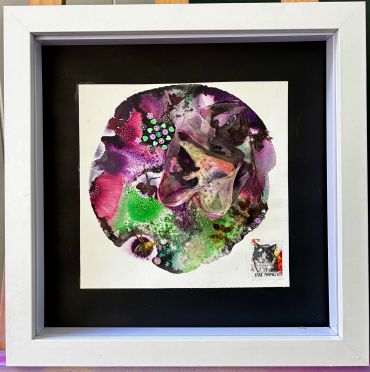 Colorful mixed media skull artwork with floral and mesh details in white frame.