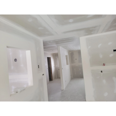 Interior walls and ceiling in drywall phase during home construction.