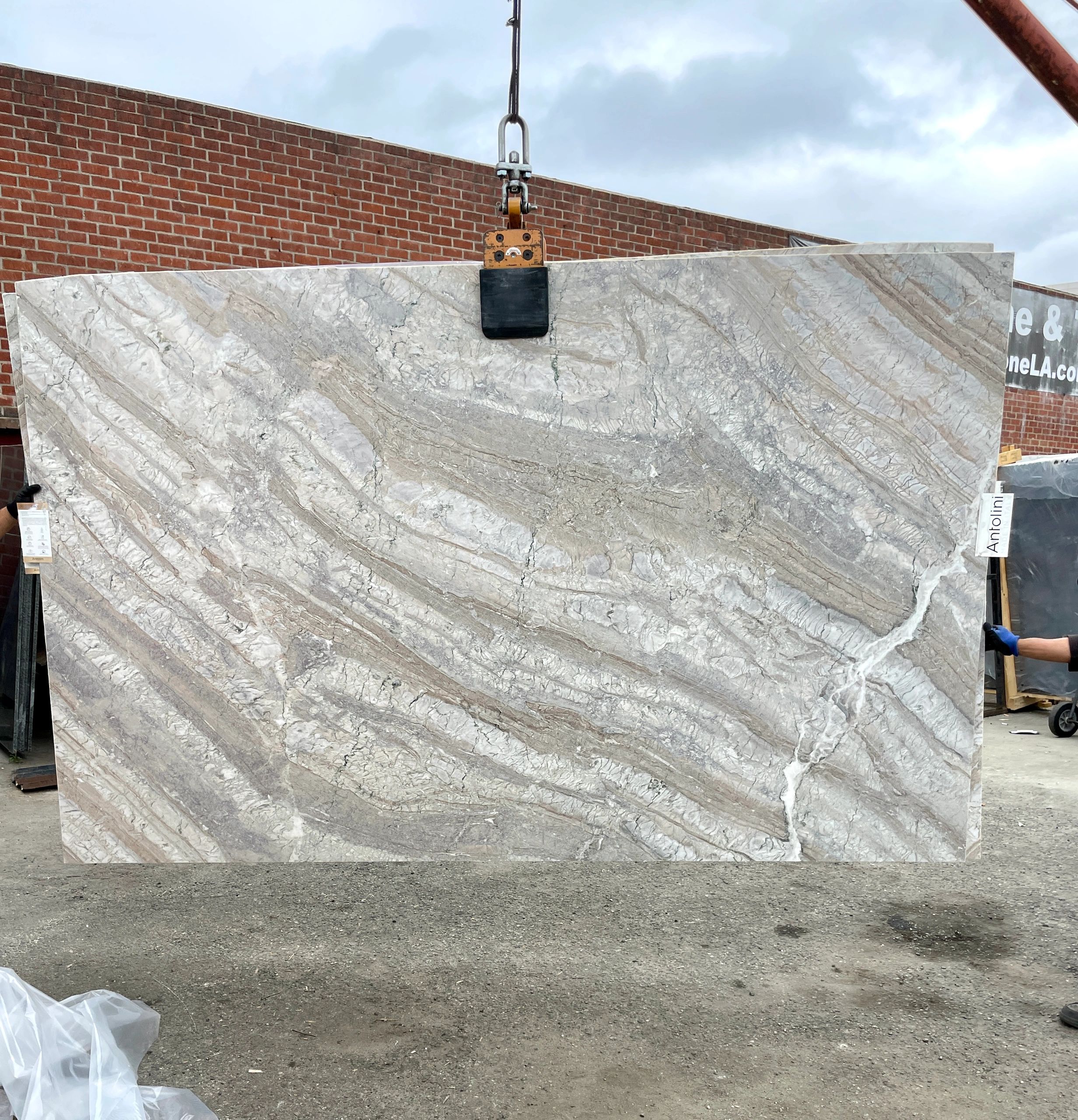 Marble natural stone slabs with leather texture the Antolini Corteccia Taupe Honed Natural Stone