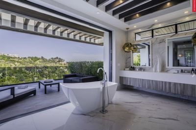 Large Format Porcelain Tiles from Royal Stone & Tile create a modern and open bathroom environment