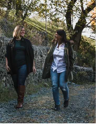 Anita & Aryn Kestel walking together along a trail.