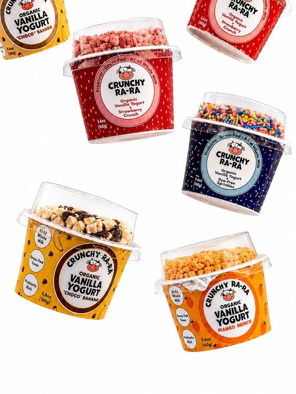 Various flavors of Crunchy Ra-Ra organic vanilla yogurt with toppings.