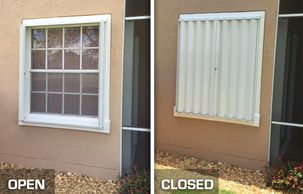 Unobstructed view of an open accordion hurricane shutter