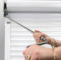 Rolling shutter hand crank operated