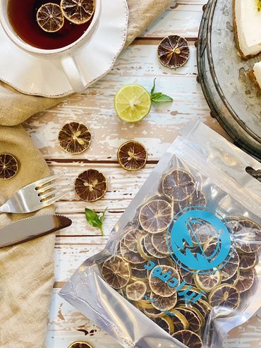 Dried lime beside the tea