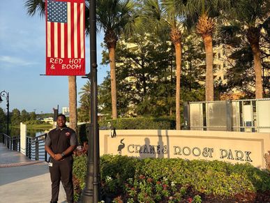 Person standing near the entrance of Change Roost Park.