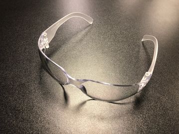 clear safety glasses on grey surface by Alpha Embroidery & Digital Screen Printing