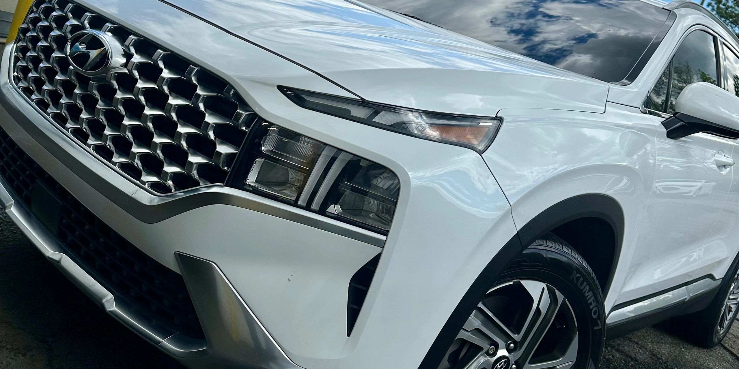 Professional exterior detailing service on a white SUV in Melbourne, Florida. Clean, glossy finish a