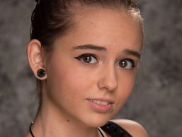 A portrait of a woman with piercings