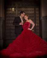 A man and a woman in black and red