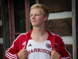 A young man showing his sports tank top