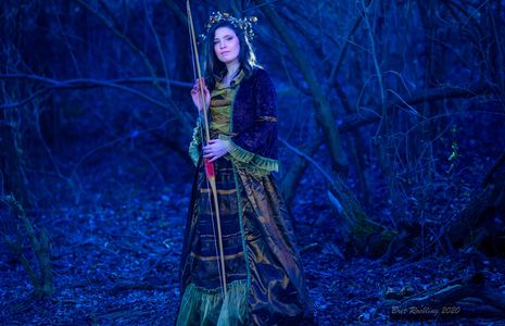 A woman in a dress in the forest