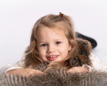 A girl in a brown fur apparel