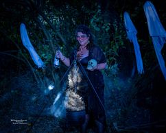 A woman cosplaying as a witch