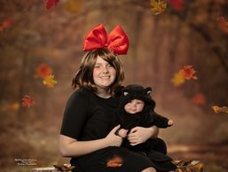 A woman and her baby in costumes