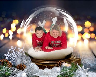 A snow globe of a mother and son
