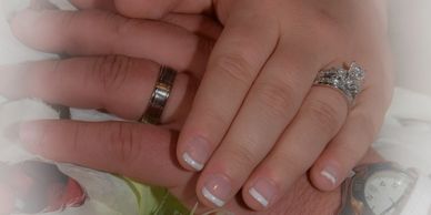 Hands showing wedding rings