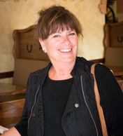 A woman in black smiling