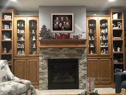 A family photo above a fireplace
