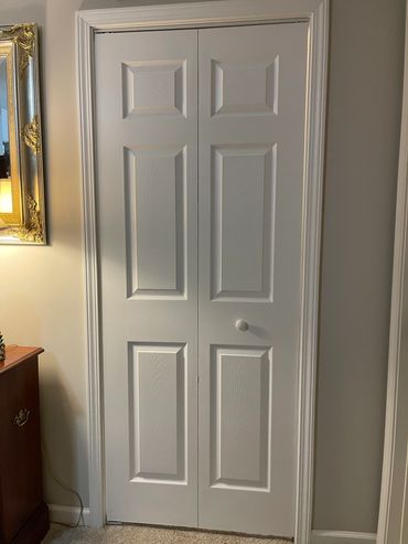 Installation of bi-folding door.