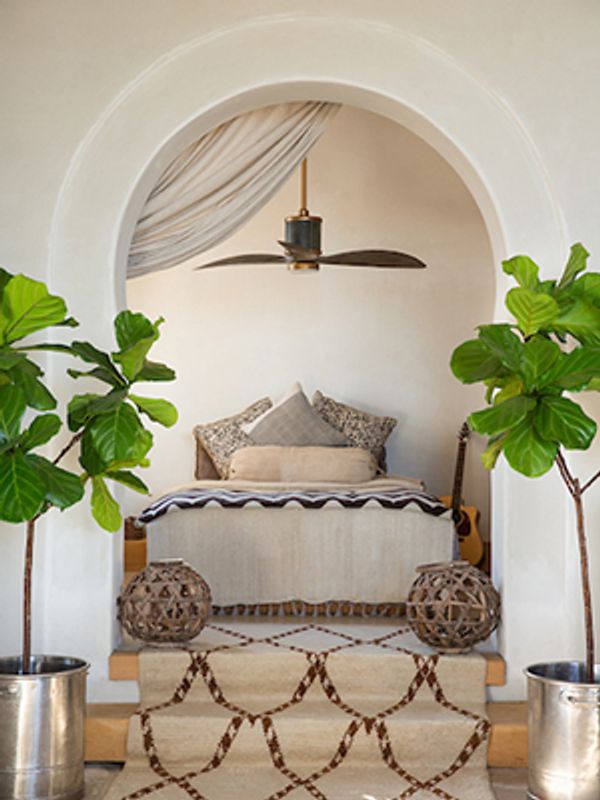 ceiling fan above a bed