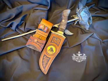 Damascus hunting bowie and brass with leather sheath Solar Storm Bladesmith Alberta Canada
