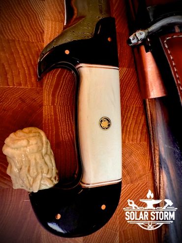 handle of CuMai damascus Kopis sword by Custom bladesmith in Alberta Canada