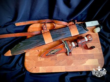 Dagger and CuMai damascus Kopis sword sheathed by Custom bladesmith in Alberta Canada