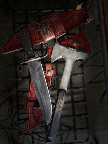 10" bowie with S guard and coffin frame handle and matching tomahawk.