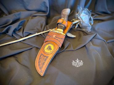 Damascus hunting bowie and brass with leather sheath Solar Storm Bladesmith Alberta Canada