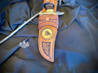 Damascus hunting bowie and brass with leather sheath Solar Storm Bladesmith Alberta Canada