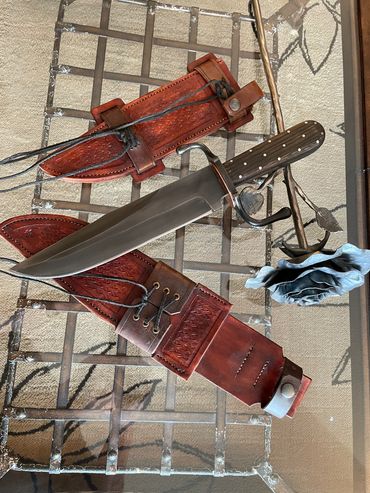 10" Bowie with Oak Frame handle. Traditional bowie with a nice long sharp blade. Scout sheath