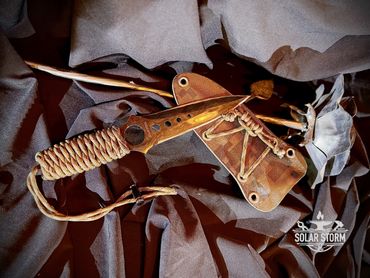 Tactical dagger by Custom Alberta Bladesmith complete with paracord handle and kydex sheath