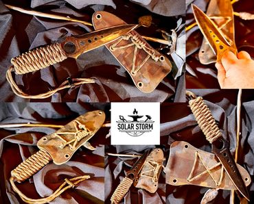 Tactical dagger by Custom Alberta Bladesmith complete with paracord handle and kydex sheath