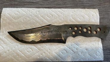 etching Damascus CuMai hunting knife.  15n20 and 1084 copper shims epoxy dragon scales handle