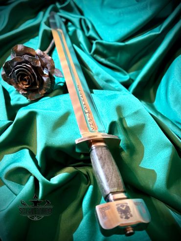 Viking sword by custom sword maker and swordsmith from Alberta Canada complete with Runes and Coat o