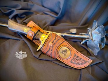 Damascus hunting bowie and brass with leather sheath Solar Storm Bladesmith Alberta Canada